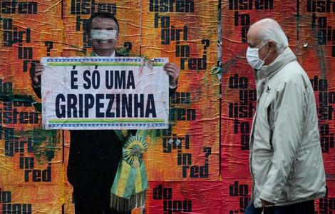 Criticism of Bolsonaro and his management of COVID-19 on a wall in Sao Paulo